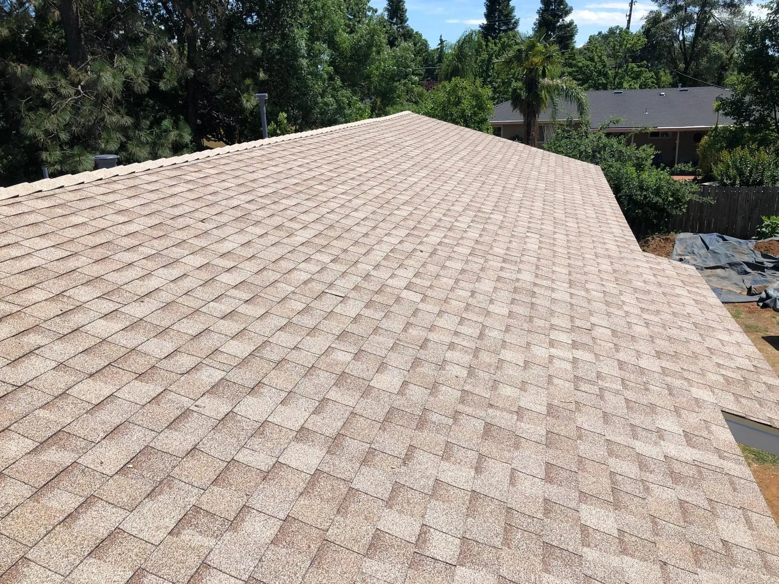 After: Tan composition shingle re-roof