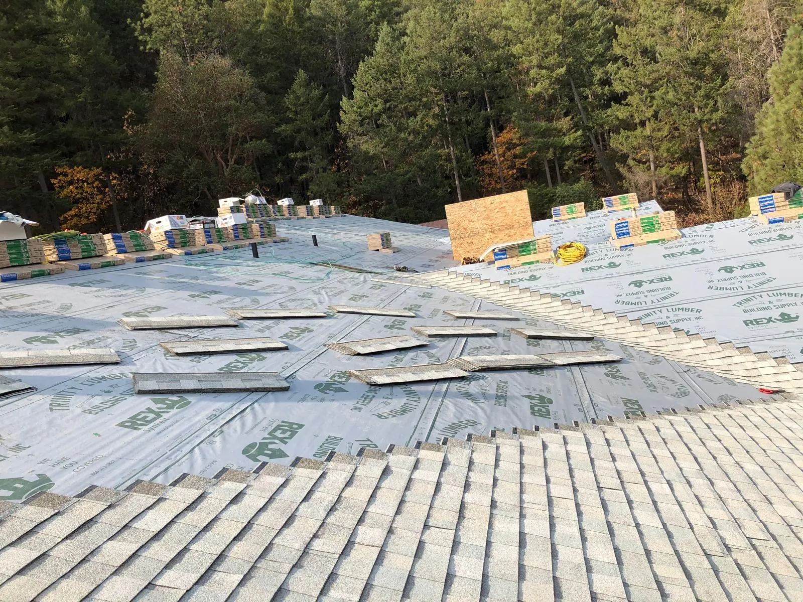 Before: Gray shingles: underlayment to finished roof