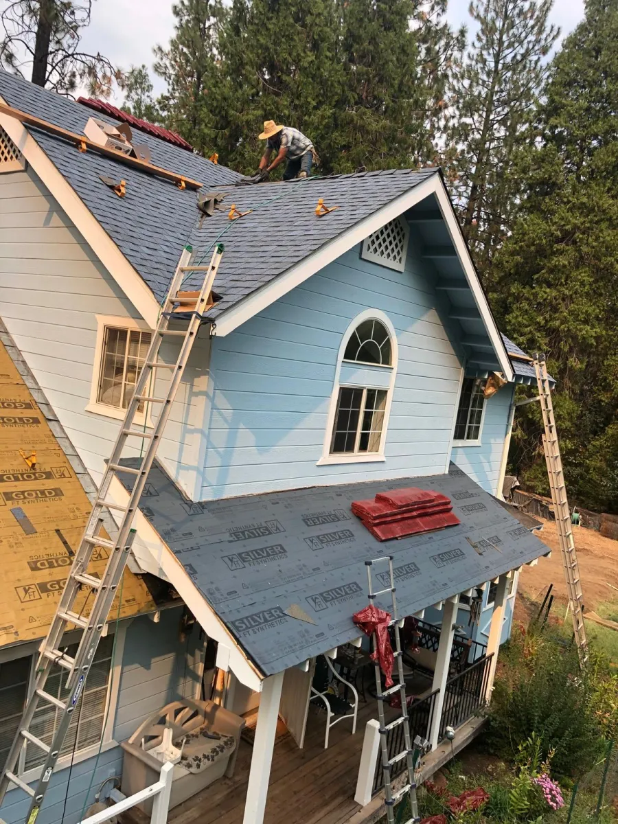 After: Blue house re-roof with new underlayment
