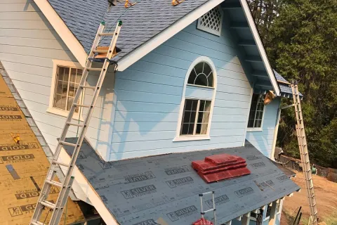 Blue house re-roof with new underlayment