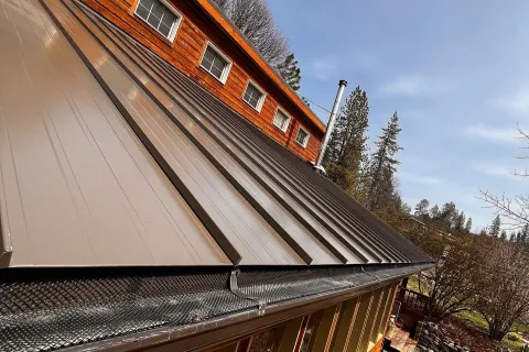 Standing seam metal roof with gutter guards