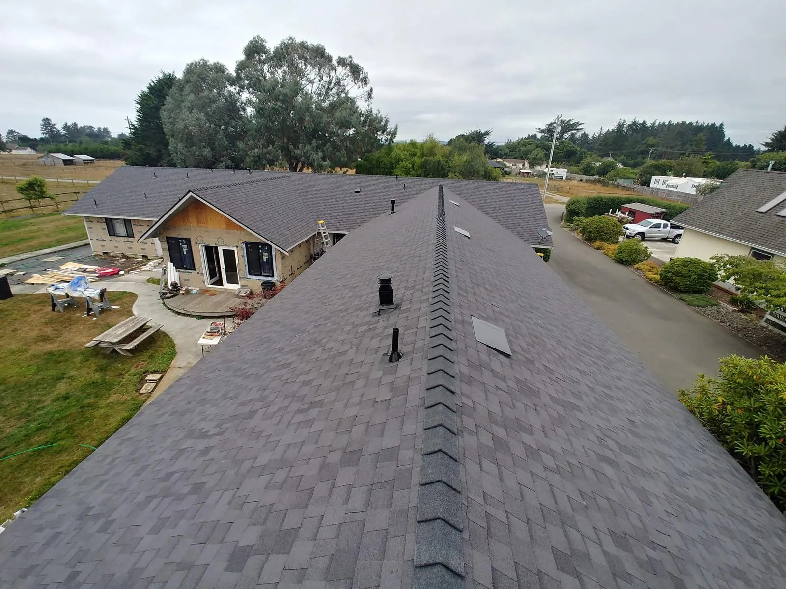 After: Gray composition shingle roof, ridge view
