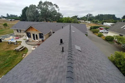 Gray composition shingle roof, ridge view