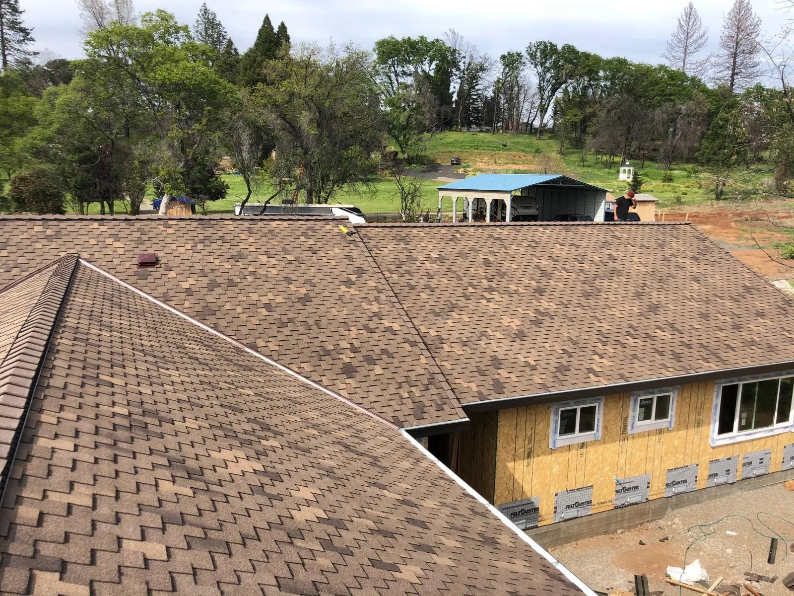 After: Brown composition shingles on a home addition
