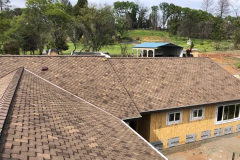 Brown composition shingles on a home addition
